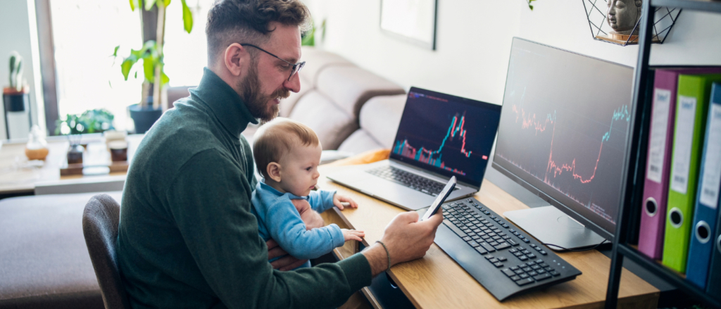 dad and child on the computer looking at investments